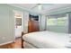 Cozy bedroom with a dresser, television, and an ensuite bathroom, creating a private retreat at 7842 15Th N Way, St Petersburg, FL 33702