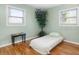 Simple bedroom with a single bed, hardwood floors, and natural light at 7842 15Th N Way, St Petersburg, FL 33702