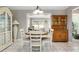 Charming dining room area with tile floors and open views of the connected living room space at 7842 15Th N Way, St Petersburg, FL 33702