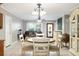 Inviting dining area with tile floors, neutral walls, and an adjacent living space, perfect for entertaining at 7842 15Th N Way, St Petersburg, FL 33702