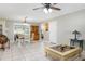 Open-concept living space with tile flooring, natural light, and neutral paint, perfect for modern living at 7842 15Th N Way, St Petersburg, FL 33702