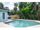 Inviting private pool surrounded by lush tropical landscaping at 7842 15Th N Way, St Petersburg, FL 33702