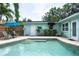 Beautiful backyard pool with outdoor seating and tropical landscaping at 7842 15Th N Way, St Petersburg, FL 33702
