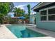 Inviting pool with lounge chairs and lush tropical landscaping at 7842 15Th N Way, St Petersburg, FL 33702