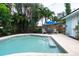 Relaxing pool area with patio seating, perfect for outdoor entertaining at 7842 15Th N Way, St Petersburg, FL 33702