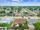 Overhead shot shows house, with cozy backyard patio and well-kept lawn in a mature residential neighborhood at 8225 Medford Dr, Port Richey, FL 34668