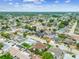 Expansive aerial view of a residential neighborhood featuring well-maintained homes, lush landscaping, and tree-lined streets at 8225 Medford Dr, Port Richey, FL 34668