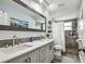 Modern bathroom featuring a dual sink vanity, tile floors, and shower at 8225 Medford Dr, Port Richey, FL 34668