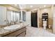 Bright bathroom features a granite-look countertop, tile floors, a toilet and a shower at 8225 Medford Dr, Port Richey, FL 34668