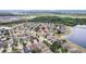 Overhead shot of neighborhood highlighting proximity to a lakeside location, offering beautiful nature scenery at 8407 Hunters Fork Loop, Ruskin, FL 33573