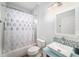 Bathroom features vanity with modern sink, shower, bathtub, and tiled backsplash at 8407 Hunters Fork Loop, Ruskin, FL 33573