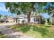 Beautiful single-story home featuring a brick driveway, a two-car garage, and mature landscaping at 8407 Hunters Fork Loop, Ruskin, FL 33573