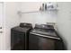 Laundry room features newer model, front-loading Samsung washer and dryer set at 8407 Hunters Fork Loop, Ruskin, FL 33573