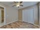 Bedroom with wood-look flooring and a closet at 925 Windton Oak Dr, Ruskin, FL 33570