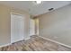 This bedroom features wood floors and closet at 925 Windton Oak Dr, Ruskin, FL 33570