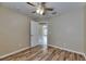 This bedroom features wood floors and a ceiling fan at 925 Windton Oak Dr, Ruskin, FL 33570