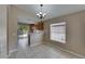 Cozy dining area with tile flooring, a chandelier, and access to the patio at 925 Windton Oak Dr, Ruskin, FL 33570