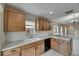 Bright kitchen featuring light wood cabinets and a white subway tile backsplash at 925 Windton Oak Dr, Ruskin, FL 33570