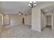 Large, open living room with tile flooring and a view of the front entrance at 925 Windton Oak Dr, Ruskin, FL 33570