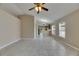 Open-concept living area with tile floors leading to a bright kitchen at 925 Windton Oak Dr, Ruskin, FL 33570