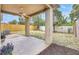 Covered patio with a ceiling fan overlooking a fenced backyard at 925 Windton Oak Dr, Ruskin, FL 33570