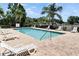 Community pool featuring lounge chairs and landscaping at 925 Windton Oak Dr, Ruskin, FL 33570