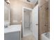 Bathroom featuring vanity, walk-in tub with shower at 949 Virginia St, Dunedin, FL 34698