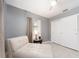 Bedroom with daybed, side table, and double door closet at 949 Virginia St, Dunedin, FL 34698
