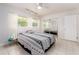 Bedroom with mirrored closet doors and natural light at 949 Virginia St, Dunedin, FL 34698