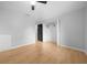 Bedroom with wood-look floors, closet, and natural light at 9613 River Rd, Spring Hill, FL 34608