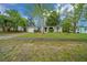 A charming single-story home with a well-manicured lawn and private driveway at 9613 River Rd, Spring Hill, FL 34608