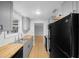 Bright kitchen with butcher block countertops, stainless steel sink, and wood-look floors at 9613 River Rd, Spring Hill, FL 34608