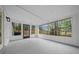 Enclosed sunroom with multiple windows offering backyard views at 9613 River Rd, Spring Hill, FL 34608
