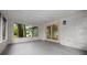 Bright sunroom with a view to the back yard at 9613 River Rd, Spring Hill, FL 34608