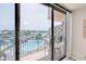 Balcony featuring pool views and seating for two at 1 Key Capri # 502E, Treasure Island, FL 33706