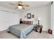 Comfortable bedroom features a full bed, plush pillows, closet, and side table with a lamp at 1 Key Capri # 502E, Treasure Island, FL 33706