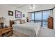 Bedroom with a large window and view of the bay at 1 Key Capri # 502E, Treasure Island, FL 33706