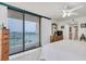 Bright bedroom with balcony access and ensuite bathroom at 1 Key Capri # 502E, Treasure Island, FL 33706