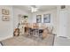 Dining area featuring wood table, seating for four, and decorative shelving at 1 Key Capri # 502E, Treasure Island, FL 33706