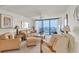 Bright and airy living room with Gulf views and neutral decor at 1 Key Capri # 502E, Treasure Island, FL 33706