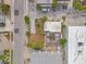 Birds eye view of a property highlighting the proximity to shops and restaurants, with a screened-in pool at 101 11Th Ave, St Pete Beach, FL 33706