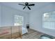 Simple bedroom with a minimalist style with two windows letting in natural light at 1051 44Th S St, St Petersburg, FL 33711