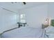 Bedroom with light walls, a comfortable bed, and a window for natural light at 1051 44Th S St, St Petersburg, FL 33711