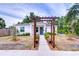 Charming home with a walkway trellis, fresh landscaping, and a welcoming front porch creates immediate curb appeal at 1051 44Th S St, St Petersburg, FL 33711