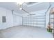 An immaculate two-car garage with clean white walls and a smooth concrete floor offering ample storage space at 1051 44Th S St, St Petersburg, FL 33711