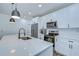 Bright kitchen with modern appliances, white cabinetry, and a large island perfect for food preparation at 1051 44Th S St, St Petersburg, FL 33711
