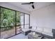 Screened in lanai with comfortable seating and a view of the backyard at 1051 44Th S St, St Petersburg, FL 33711