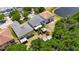 Aerial shot of homes with green surroundings and yard sheds in fenced backyards, offering a private setting at 10636 Dawns Light Dr, Riverview, FL 33578
