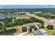 Aerial view of a neighborhood with a lake and highway at 10636 Dawns Light Dr, Riverview, FL 33578