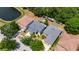 Aerial view of three homes with green landscaping at 10636 Dawns Light Dr, Riverview, FL 33578